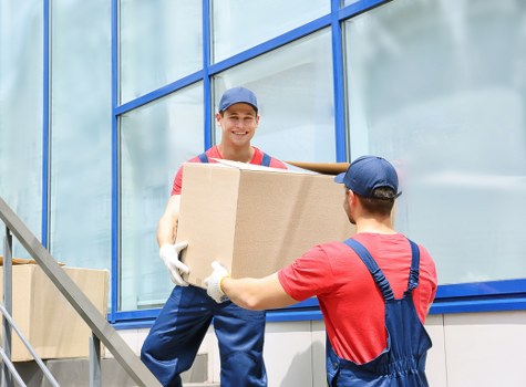 Man and van moving boxes in Crystal Palace residential street
