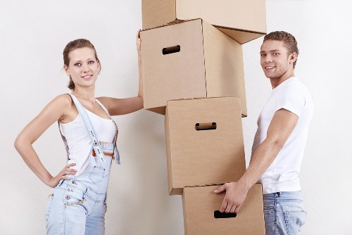 Professional movers loading items into a van for a local move